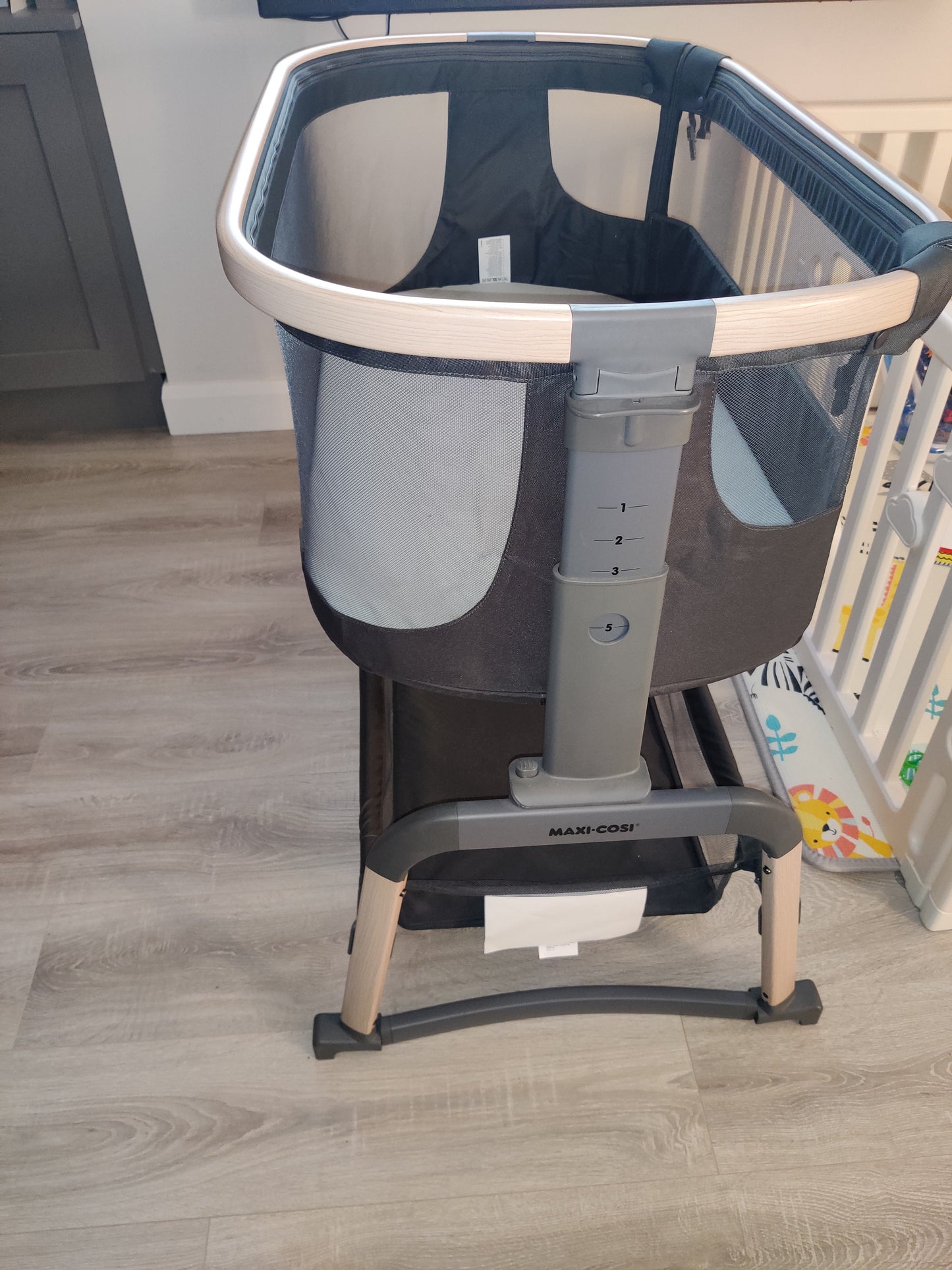 Maxi-cosi Iora Air beside crib.