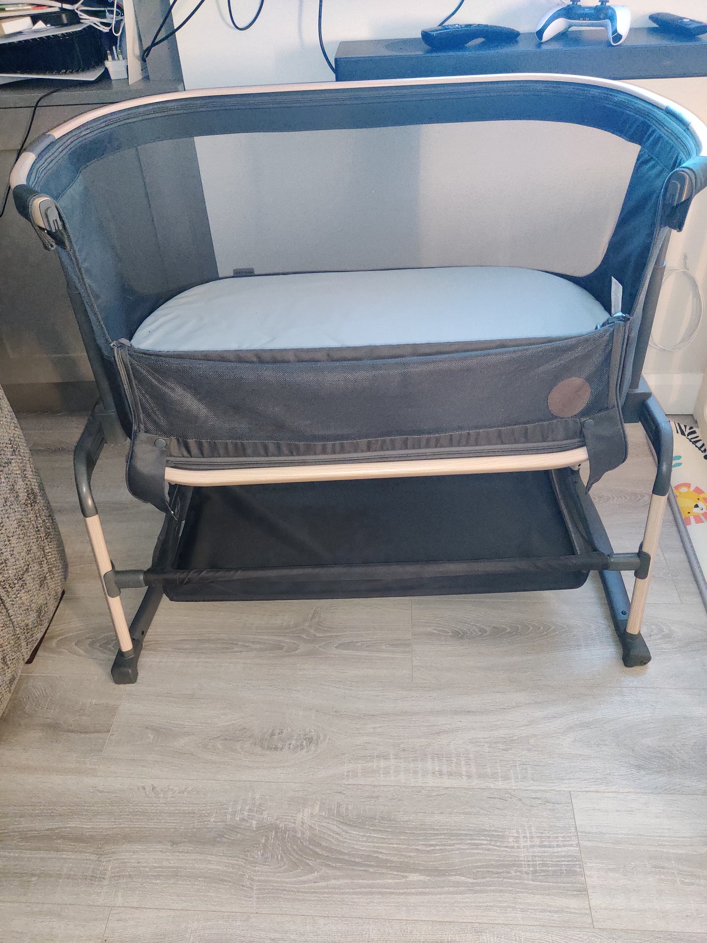 Maxi-cosi Iora Air beside crib.