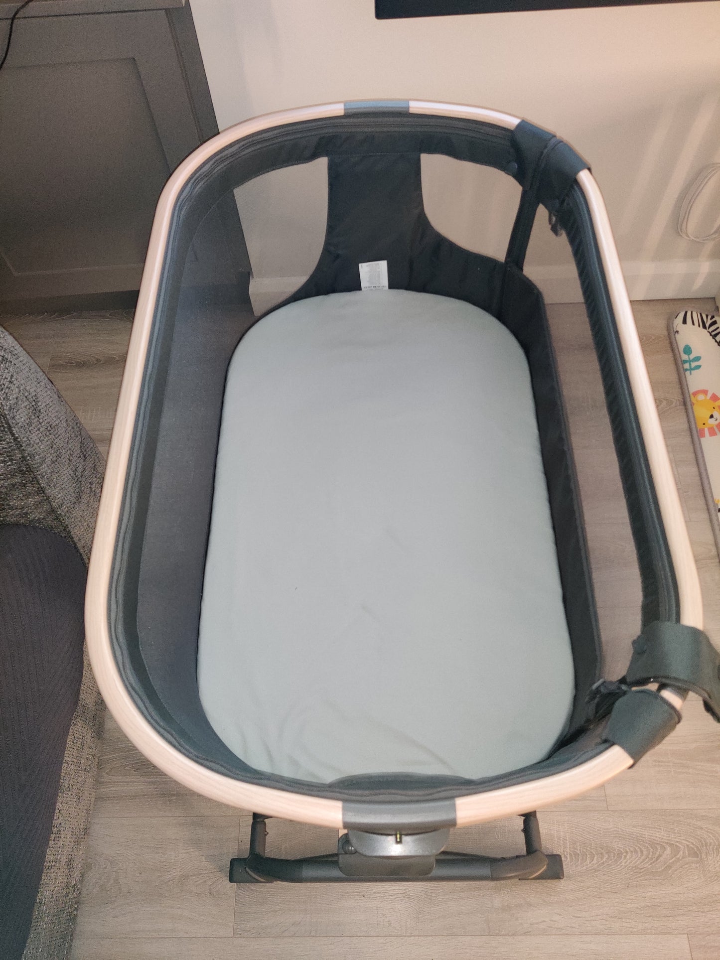 Maxi-cosi Iora Air beside crib.